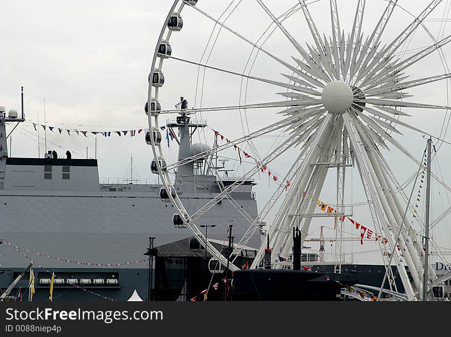 Ferris wheel, ship and flags