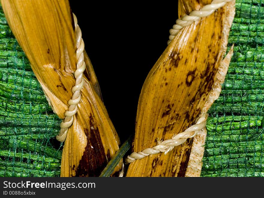 Slit green straw weave, part of a lamp shade. Slit green straw weave, part of a lamp shade.