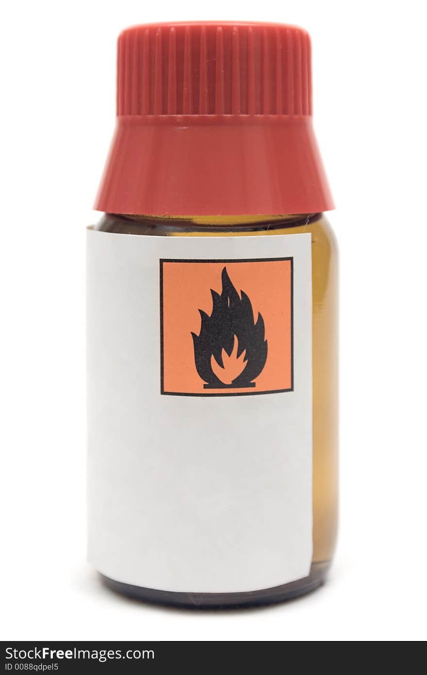 Small bottle with flammable liquid. Small bottle with flammable liquid.