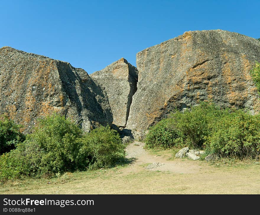 Big rocks and bushes in mountains