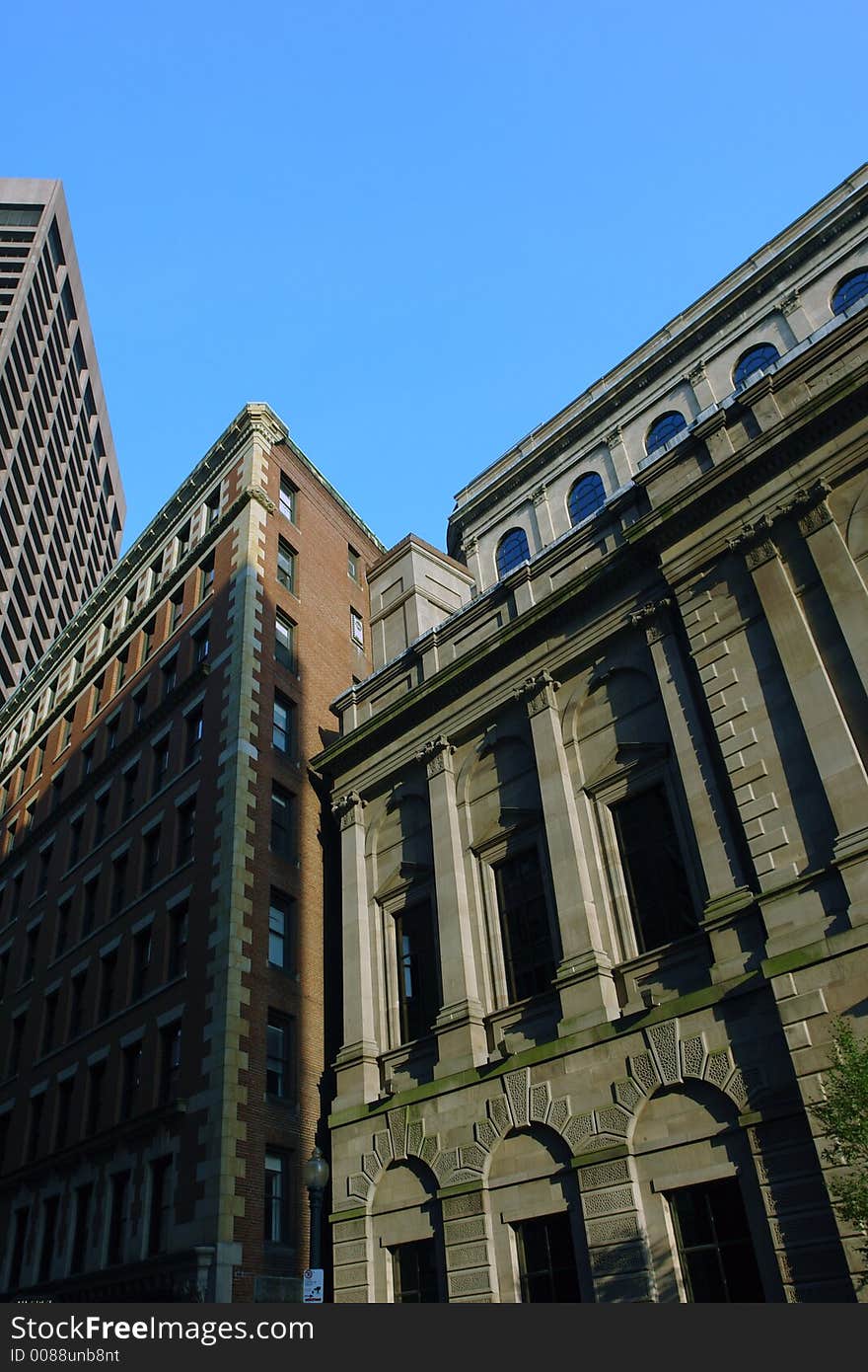 The old mixes with the new in the boston skyline, here, the bright blue sky along the roof tops forms a W. The old mixes with the new in the boston skyline, here, the bright blue sky along the roof tops forms a W.