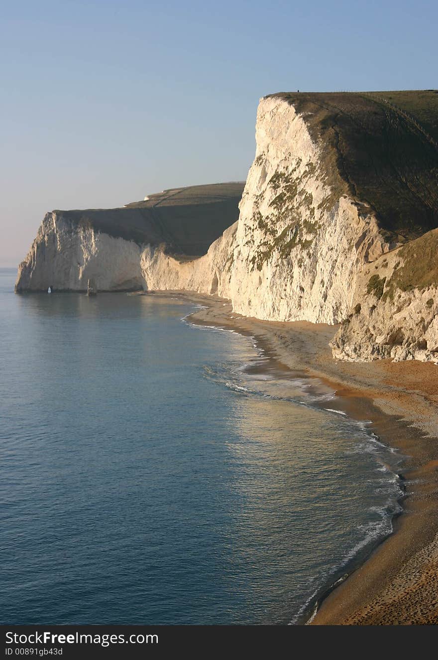 Tall cliffs and sea on a still morning. Tall cliffs and sea on a still morning