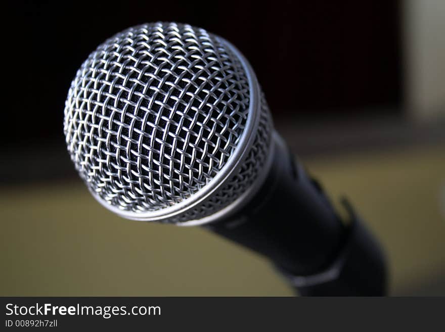 Microphone close-up near a stage