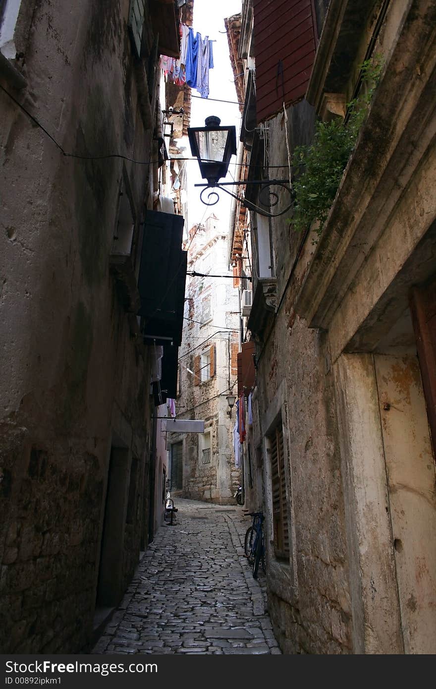 An alley in Novigrad, Croatia. An alley in Novigrad, Croatia