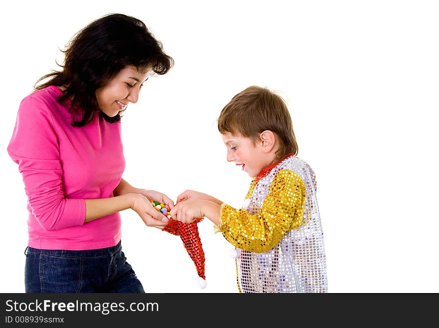 Woman giving sweets to a boy-clown on halloween. Woman giving sweets to a boy-clown on halloween