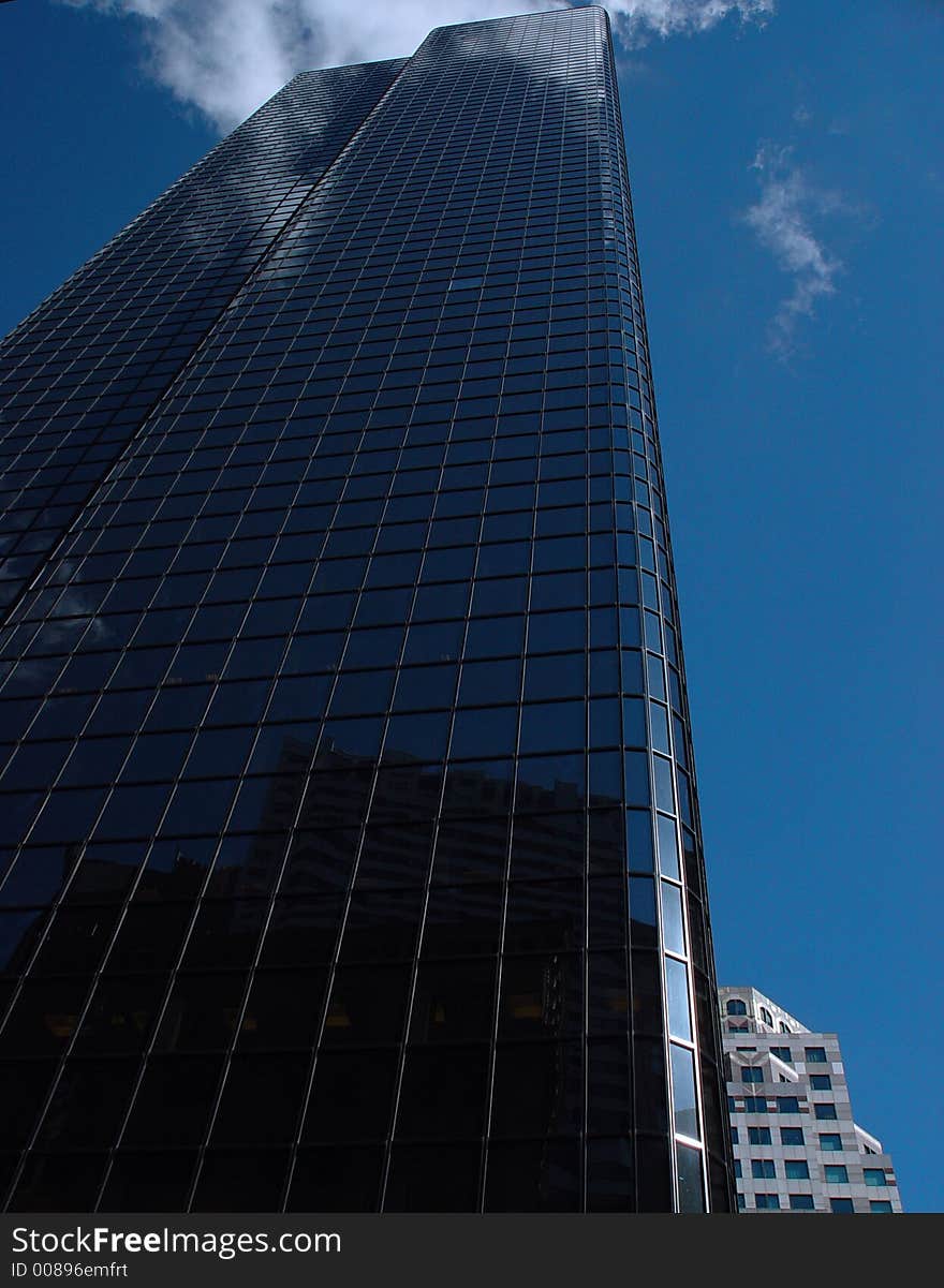 Reflective glass building on congress street in Boston. Reflective glass building on congress street in Boston.