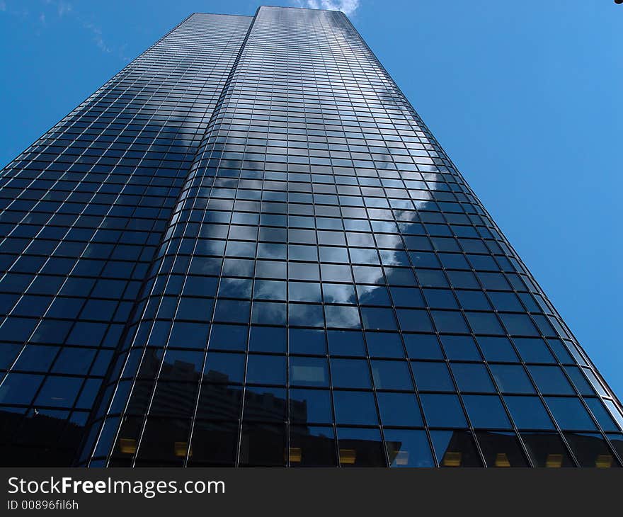 Reflective glass building in downtown Boston. Reflective glass building in downtown Boston.