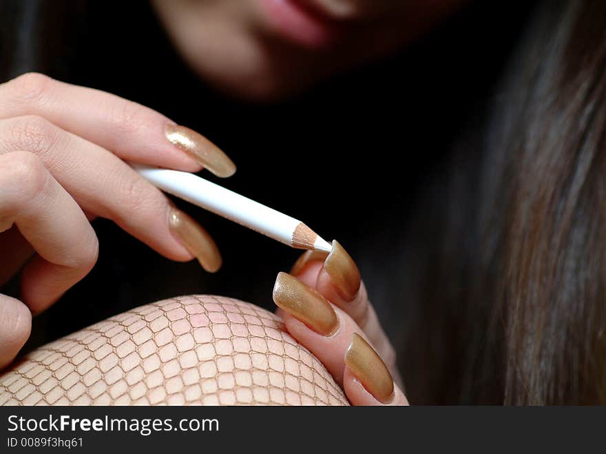 Woman making up her nails. Woman making up her nails