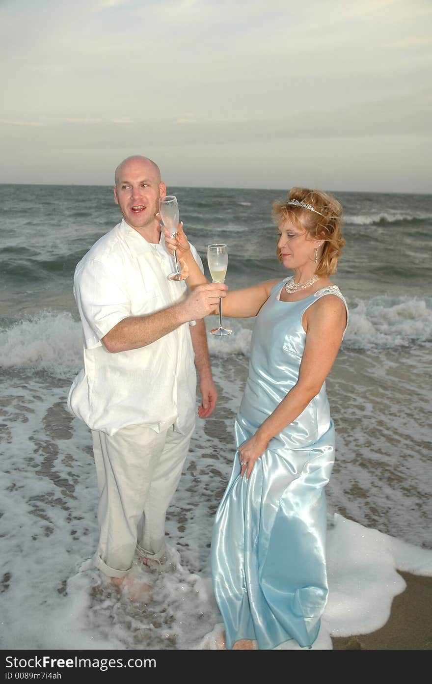 Man and woman cross arms and share or drink their glasses of wine. Celebration of love, life and marriage. Man and woman cross arms and share or drink their glasses of wine. Celebration of love, life and marriage.