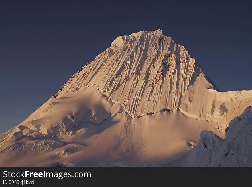 Beautiful summit Alpamayo on the sunset. Beautiful summit Alpamayo on the sunset