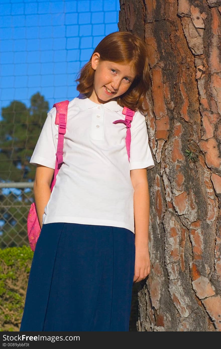 Smiling Girl By The Tree