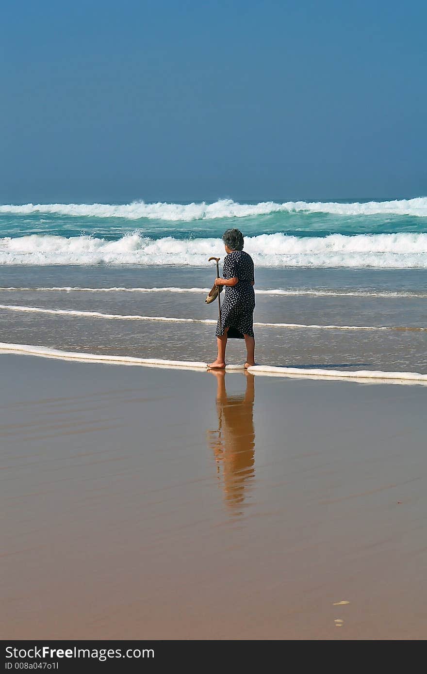 She Continues Walking On The Beach