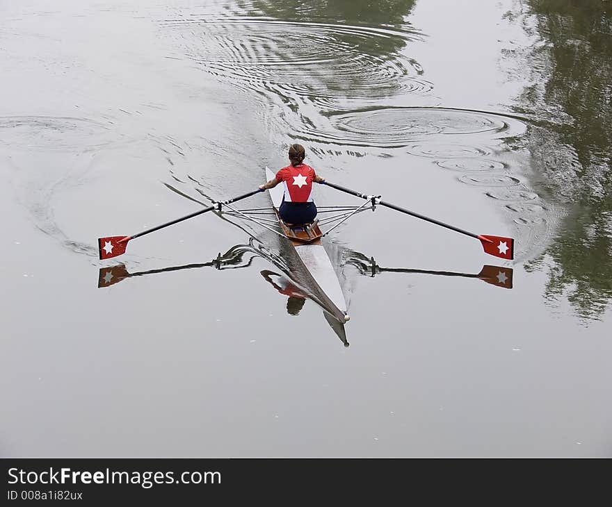 Girl with a red shirt in a skiff. Girl with a red shirt in a skiff