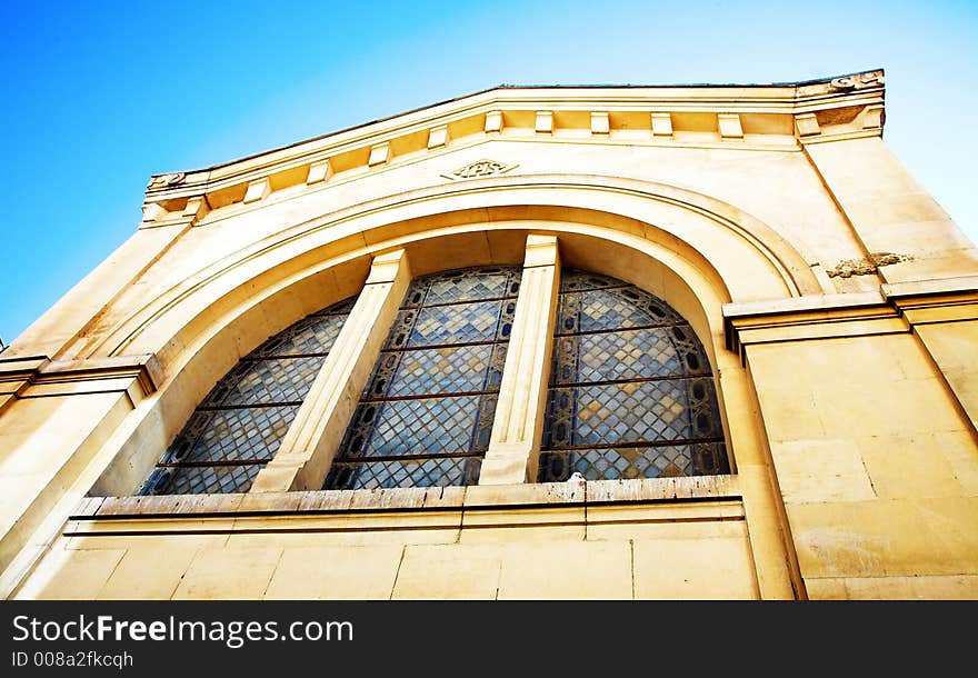 Side shot of an old chapel in France with well preserved stained windows. Side shot of an old chapel in France with well preserved stained windows