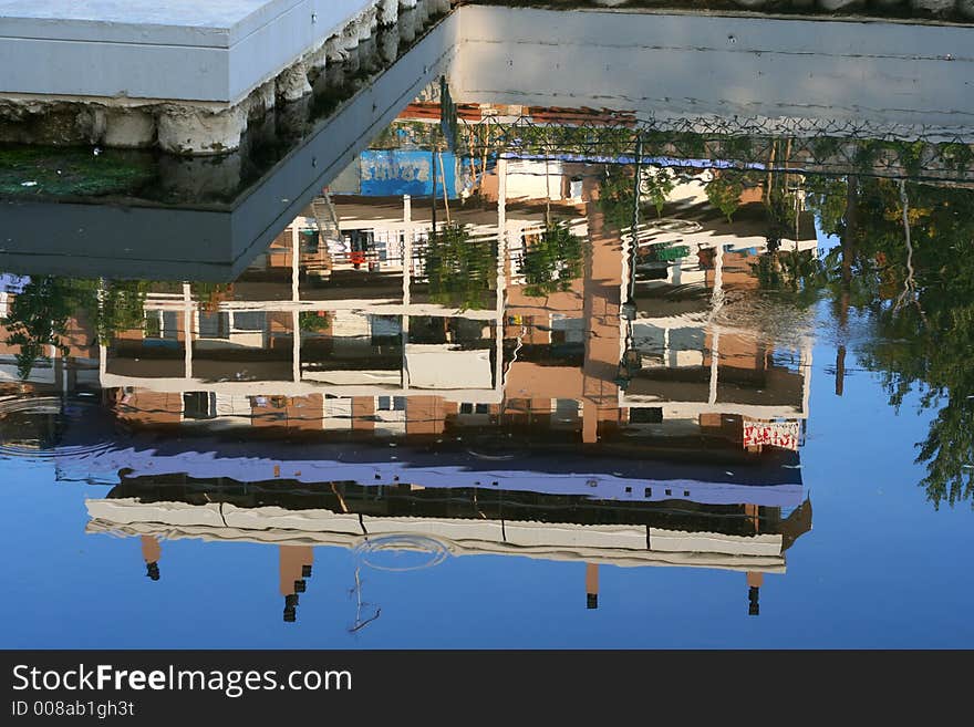 A building reflecting on the calm water. A building reflecting on the calm water