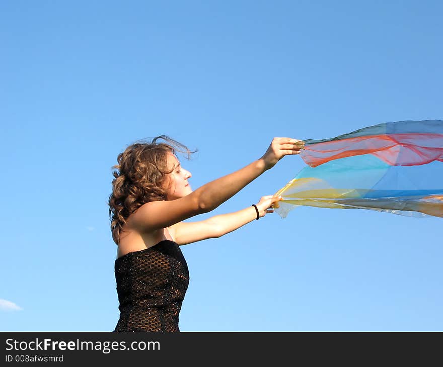 Beautiful woman playing with silk in the wind. Beautiful woman playing with silk in the wind
