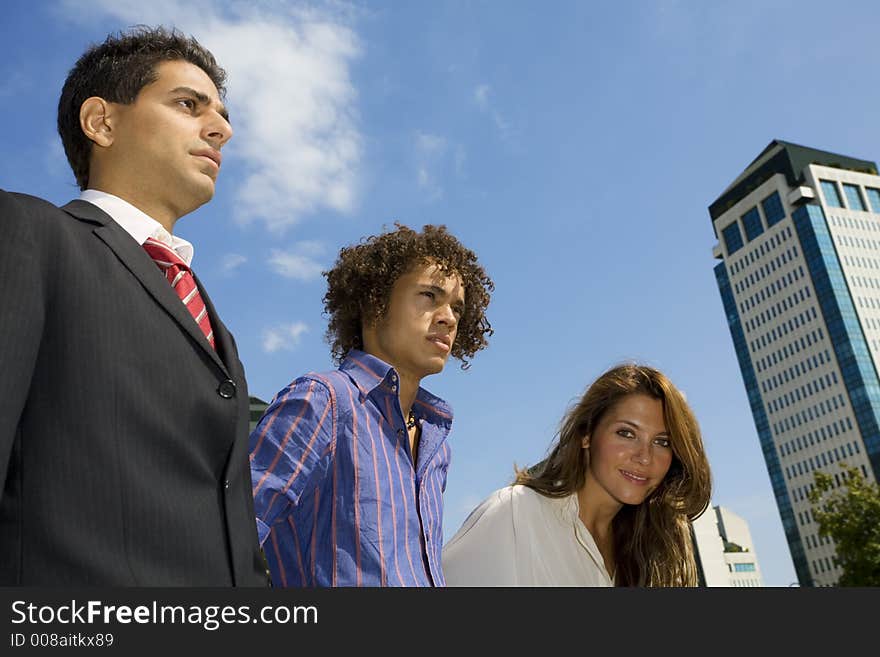 Colleagues looking away and smiling. Colleagues looking away and smiling