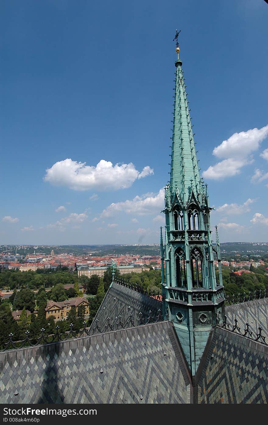 View from the Prague Castle in the Czech Republic with the cathedral central spire in the foreground. View from the Prague Castle in the Czech Republic with the cathedral central spire in the foreground