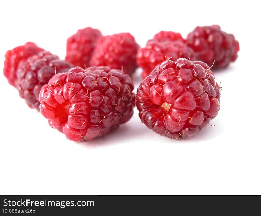 Delicious raspberries on a white back ground. Delicious raspberries on a white back ground