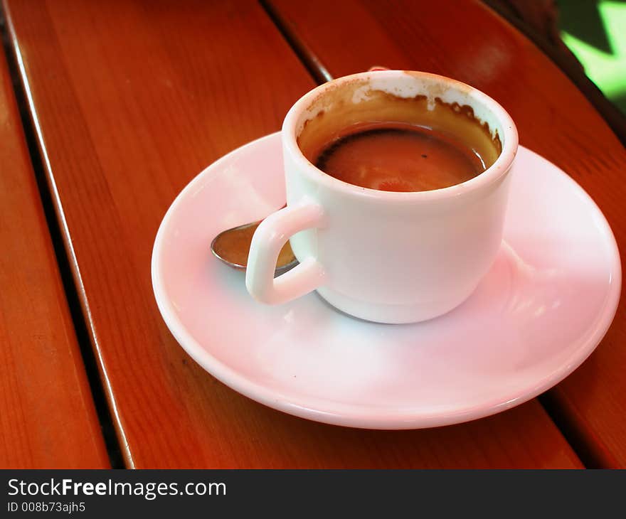 Cup of espresso on wooden table. Cup of espresso on wooden table