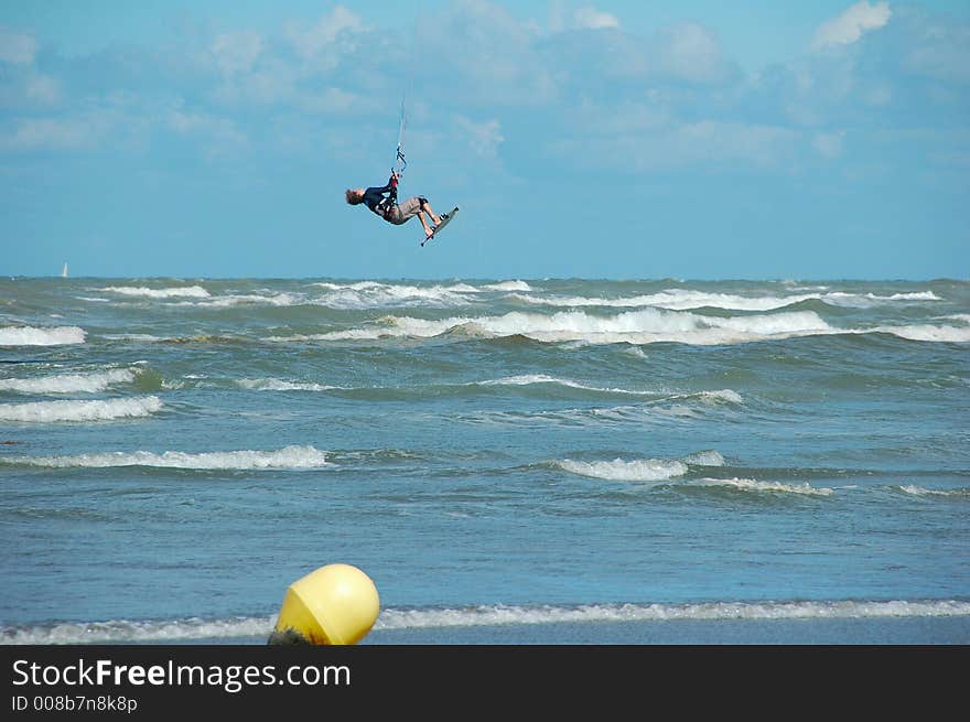 Kitesurfer making a jump, north sea,belgium. Kitesurfer making a jump, north sea,belgium