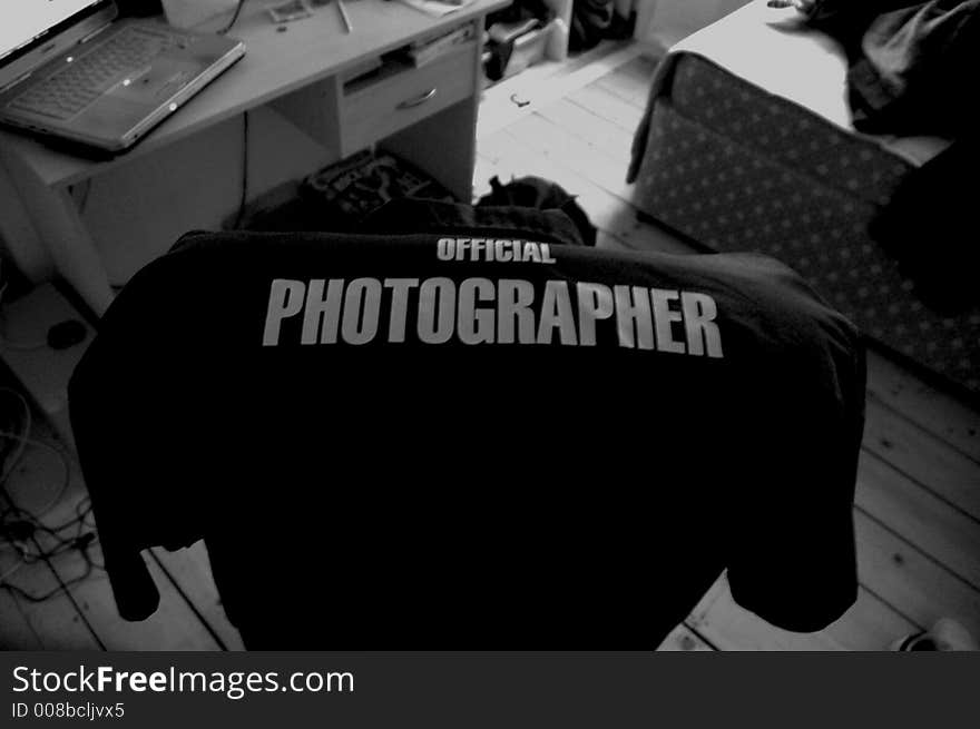 The Official Photographer Shirt on a chair need a desk. The Official Photographer Shirt on a chair need a desk.