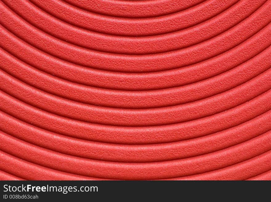 Close up of a red spiral background.