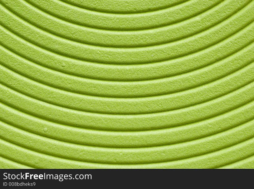 Close up of a green spiral background.