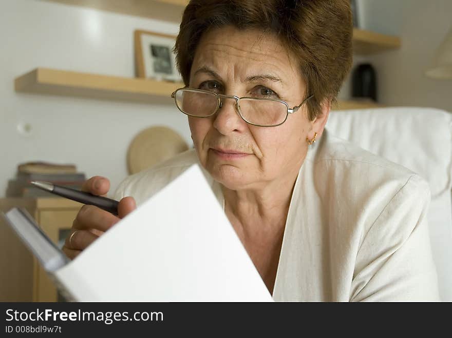 Businesswoman reading in the office