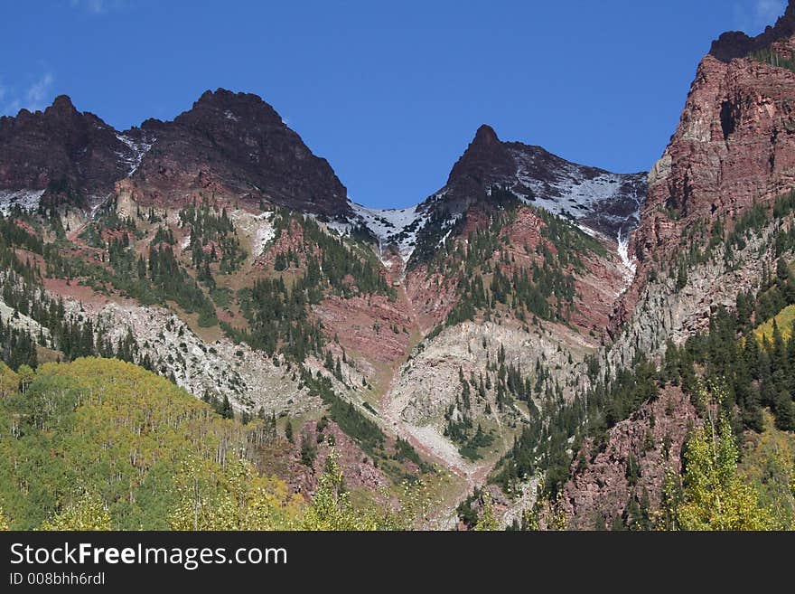 Peaks in red mountains with sparse snow. Peaks in red mountains with sparse snow