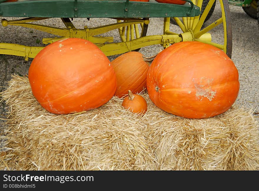 Photo of Pumpkins on a Bale of Hay