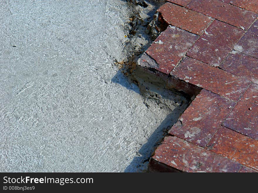 Zig zag of bricks laid on top of cement. Zig zag of bricks laid on top of cement
