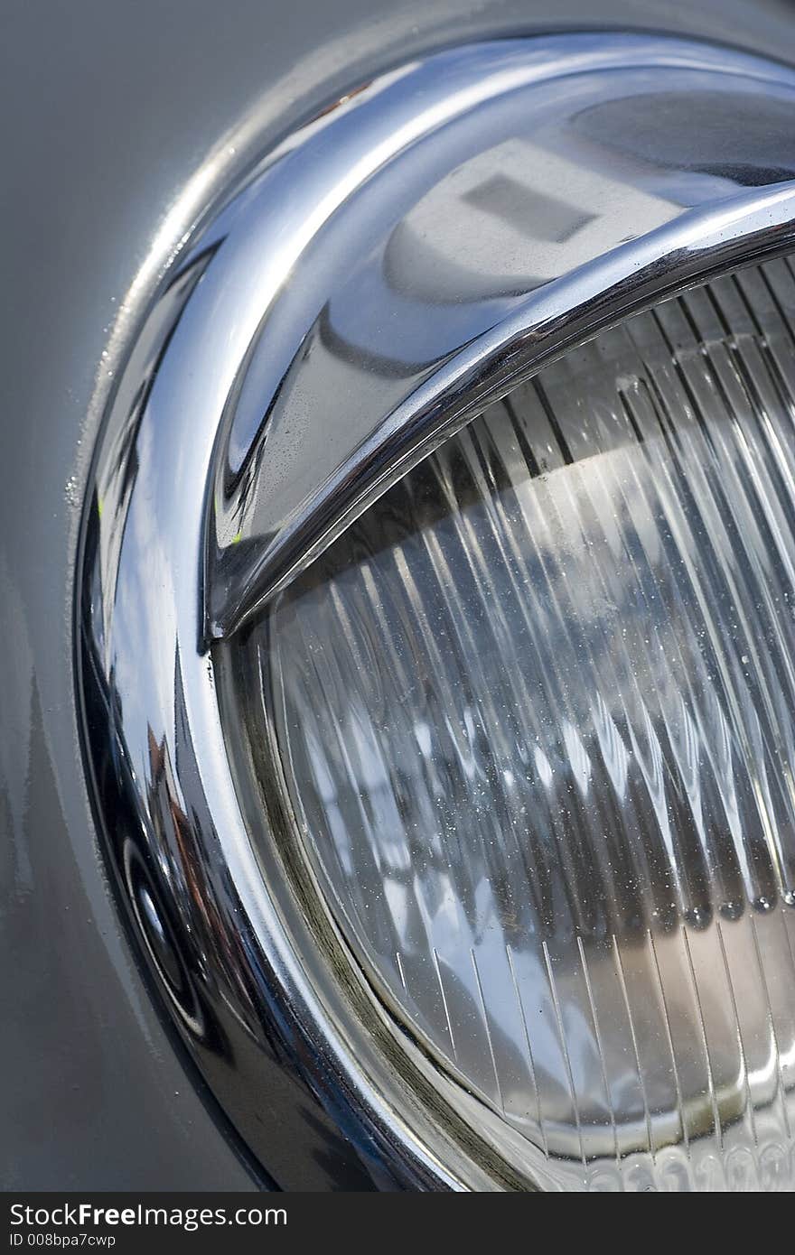 A headlight from a car. A headlight from a car