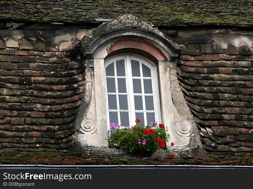 Beaune / Cote d'or France old roof an window. Beaune / Cote d'or France old roof an window