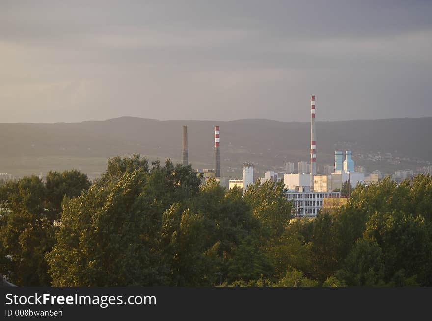 Industrial area - factory surrounded by trees.