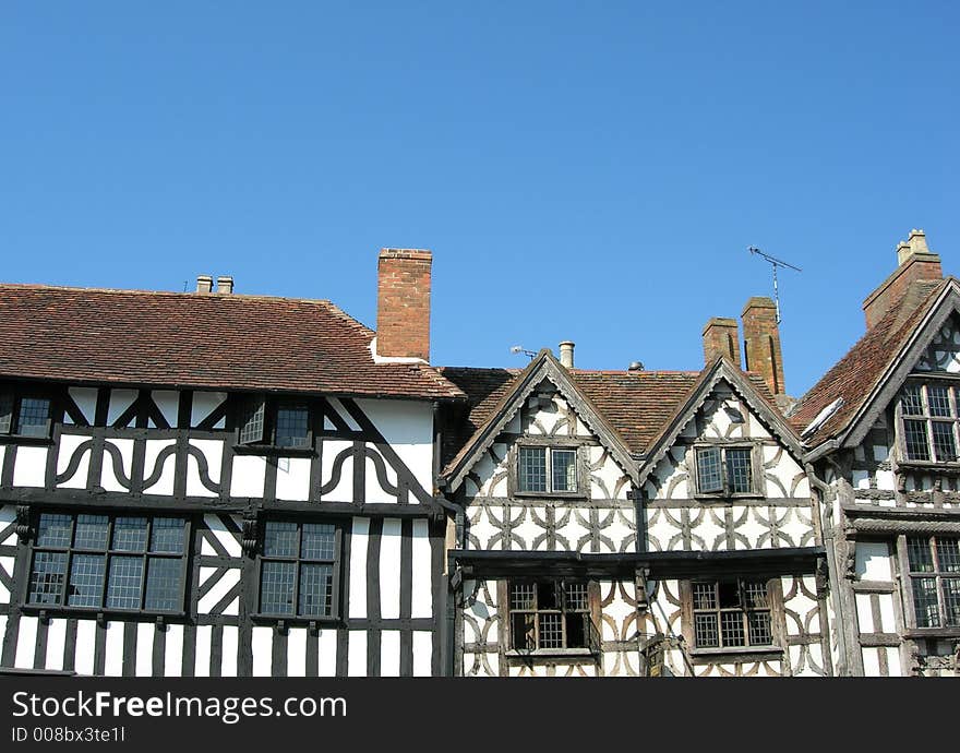 Elizabethan timber framed houses against blue sky. Elizabethan timber framed houses against blue sky