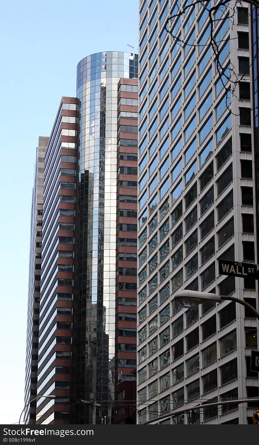 Modern mirrored skyscraper on wall Street. Modern mirrored skyscraper on wall Street