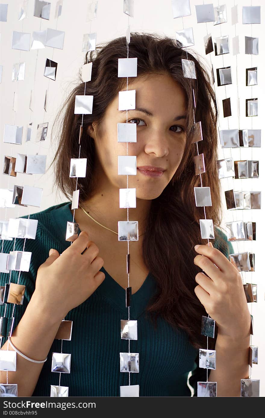 Woman behind mirrored beads