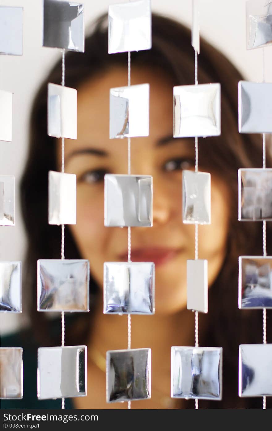 Woman Behind Mirrored Beads