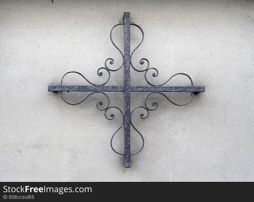 Ornate iron pattern on wall