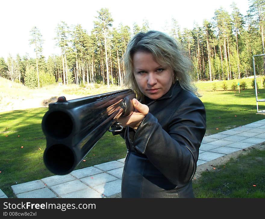 Young woman with double-barelled gun. Young woman with double-barelled gun