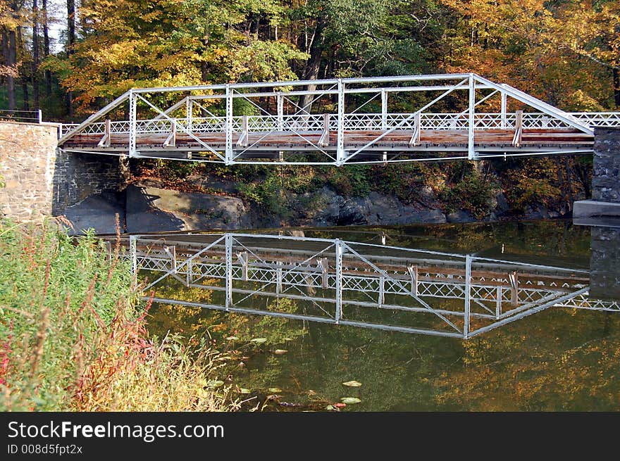 Reflection of bridge in water. Reflection of bridge in water.