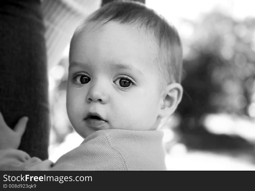 Adorable little boy playing in a park. Adorable little boy playing in a park