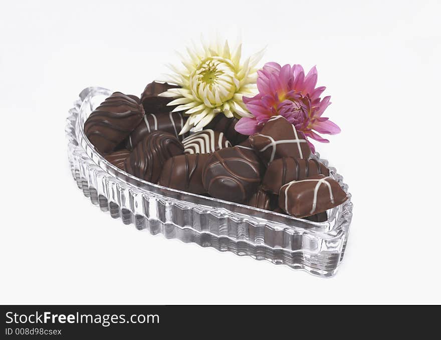 Chocolates in a christal dish with flowers