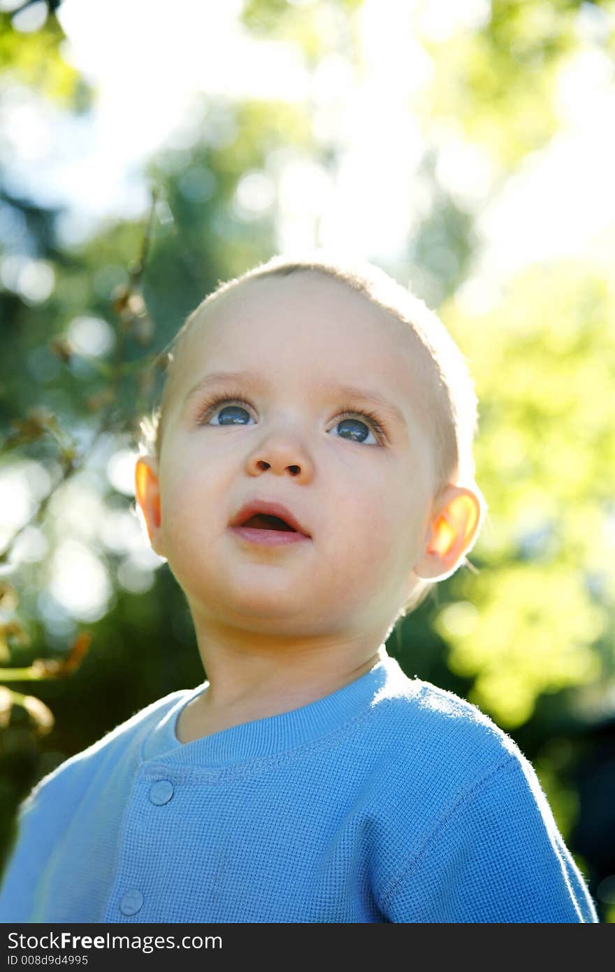 Adorable little boy playing in a park. Adorable little boy playing in a park