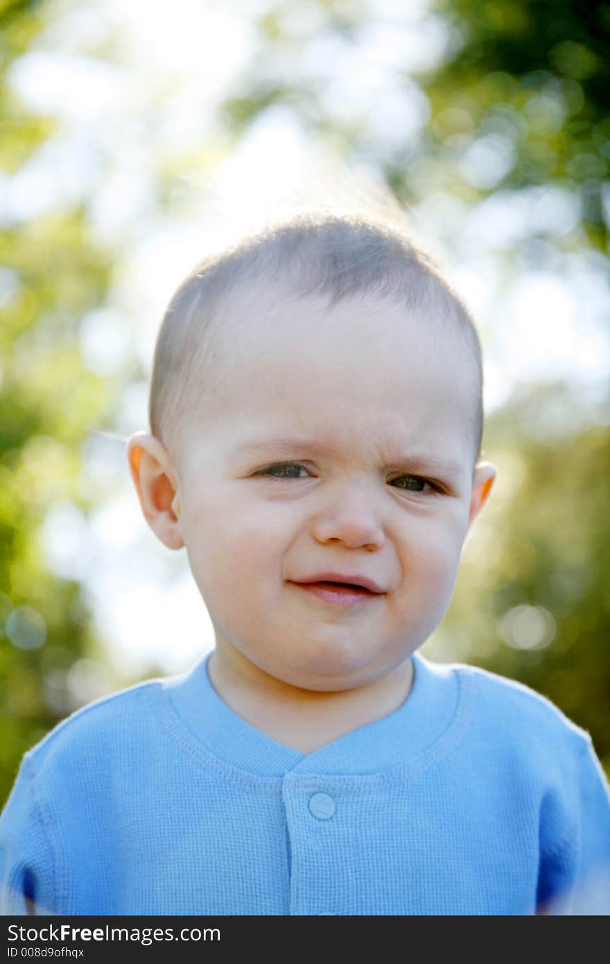 Adorable little boy playing in a park. Adorable little boy playing in a park