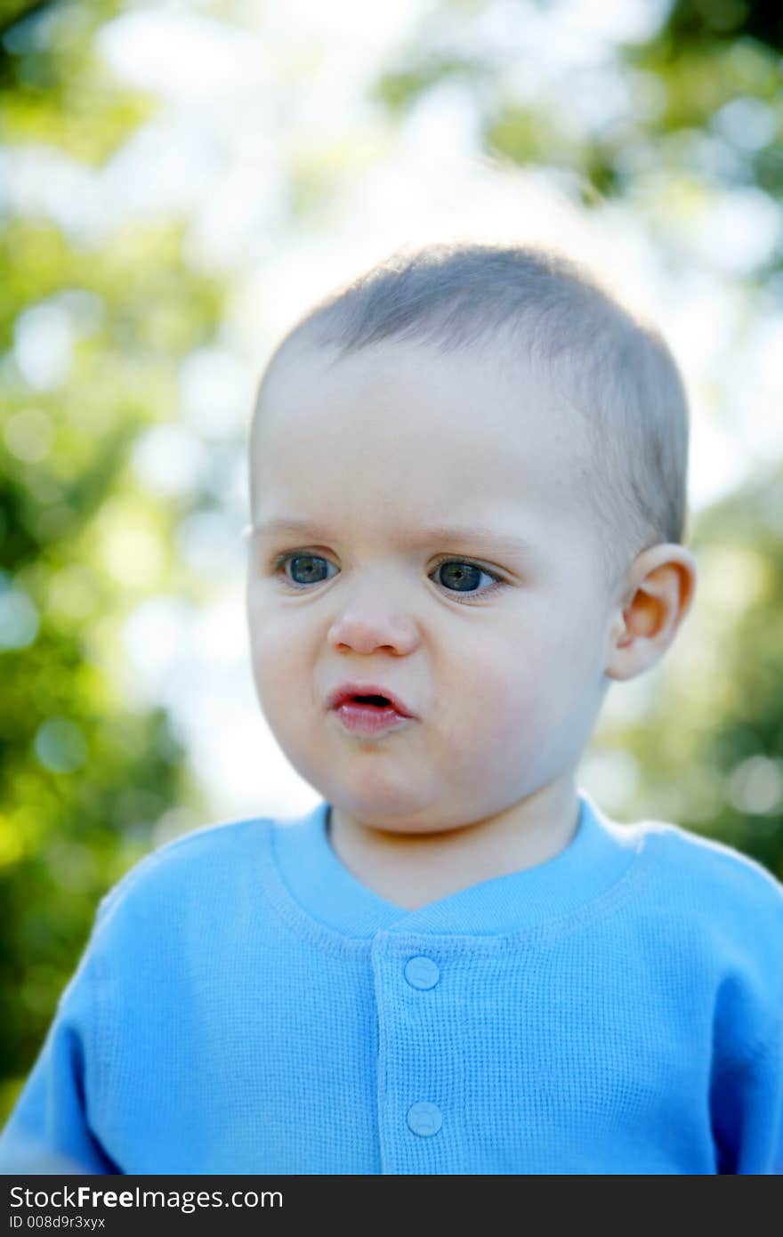 Adorable little boy playing in a park. Adorable little boy playing in a park