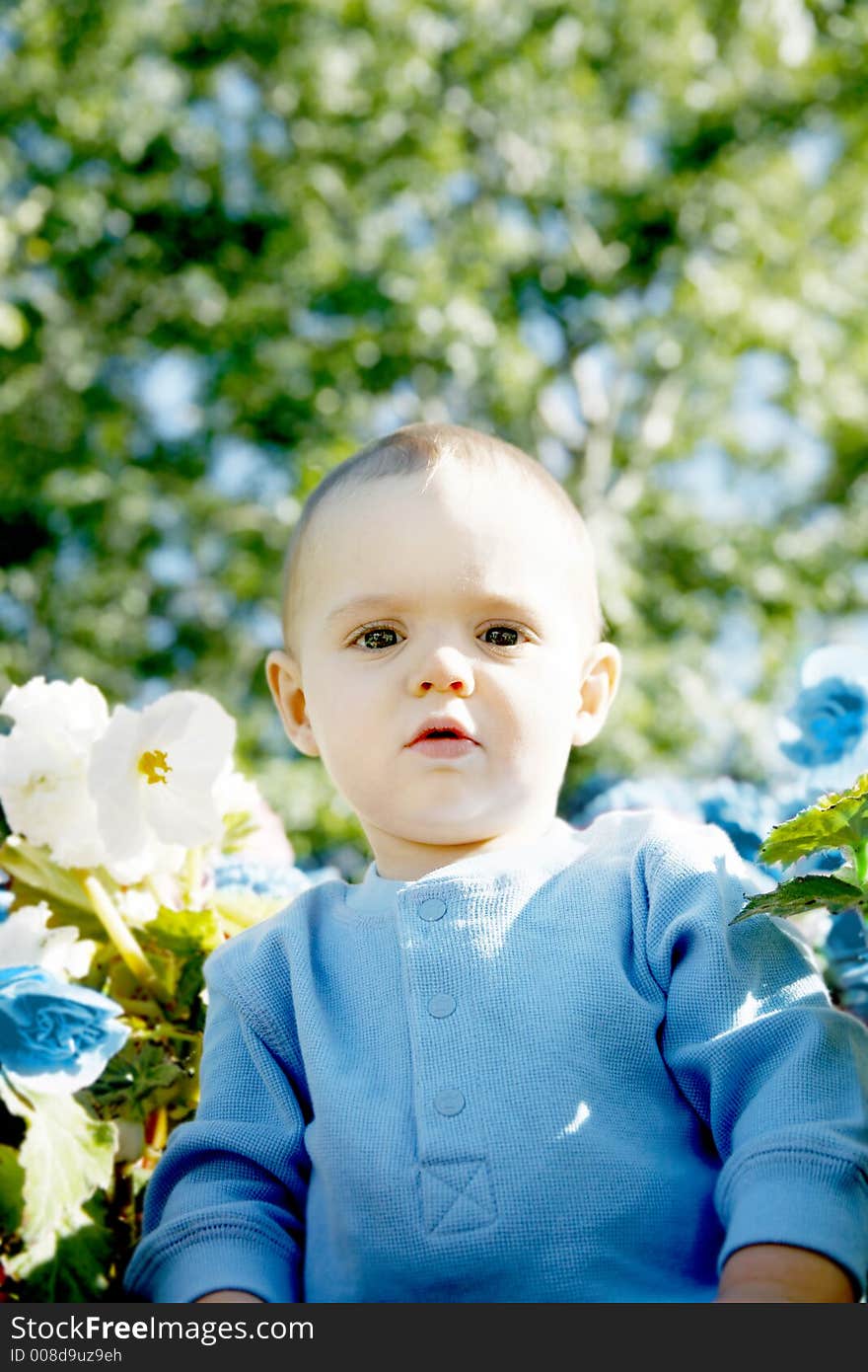 Adorable little boy playing in a park. Adorable little boy playing in a park