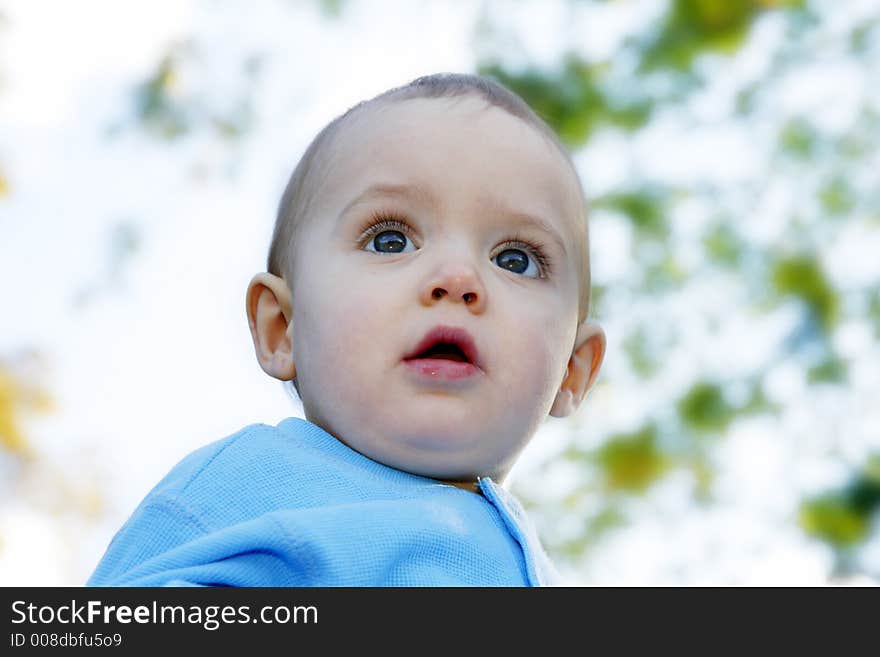 Adorable little boy playing in a park. Adorable little boy playing in a park