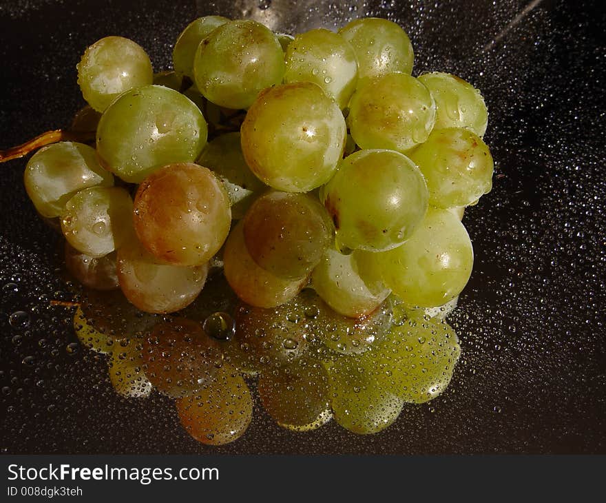 Grape with water drops on it